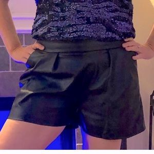 Black faux leather shorts L (2) front pockets.